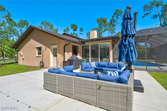 3690 27th Ave SW, Naples, FL 34117 - back of house with an outdoor living space, an outdoor pool, a patio area, and a chimney