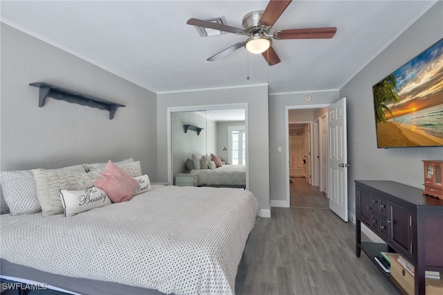 3690 27th Ave SW, Naples, FL 34117 - bedroom with ornamental molding, a closet, and wood finished floors