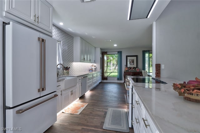 3690 27th Ave SW, Naples, FL 34117 - kitchen featuring white appliances, dark wood-style floors, white cabinets, light stone counters, and a sink