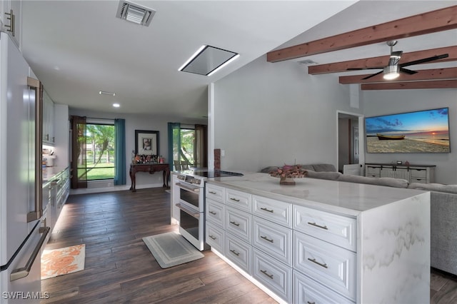 3690 27th Ave SW, Naples, FL 34117 - kitchen with dark wood-style flooring, range with two ovens, open floor plan, and high end fridge