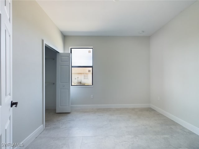 2406/2404 Hawalaska St, Lehigh Acres, FL 33973 - empty room with baseboards