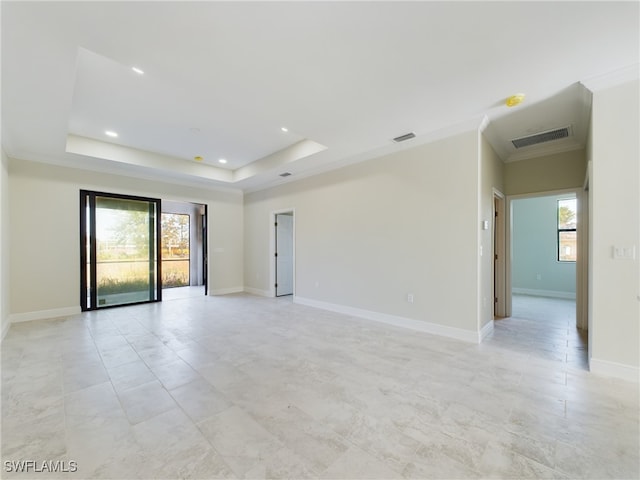 2406/2404 Hawalaska St, Lehigh Acres, FL 33973 - unfurnished room featuring a raised ceiling, ornamental molding, baseboards, and recessed lighting