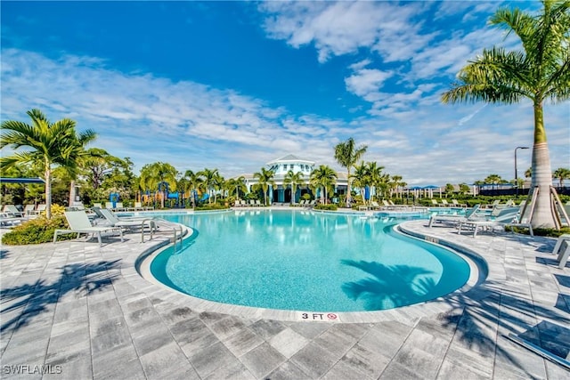 community pool with a patio area