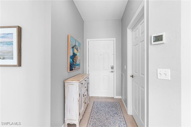 corridor featuring baseboards