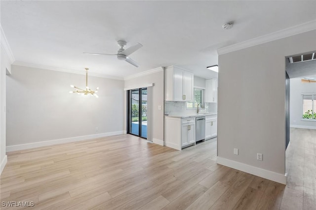 1196 Westlake Blvd, Naples, FL 34103 - unfurnished living room with light wood-type flooring, a sink, ceiling fan with notable chandelier, and ornamental molding