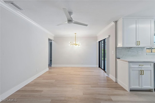 1196 Westlake Blvd, Naples, FL 34103 - unfurnished dining area featuring visible vents, crown molding, ceiling fan with notable chandelier, and a wealth of natural light