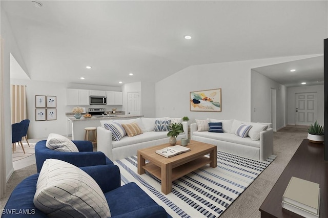 living area featuring light colored carpet, recessed lighting, and lofted ceiling