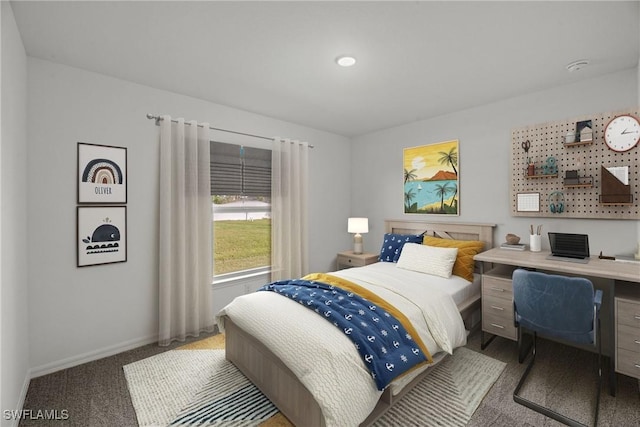 bedroom with carpet floors and baseboards