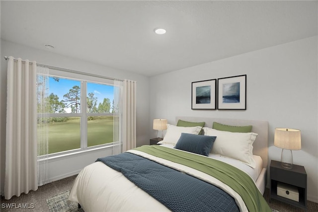 bedroom featuring carpet flooring and baseboards
