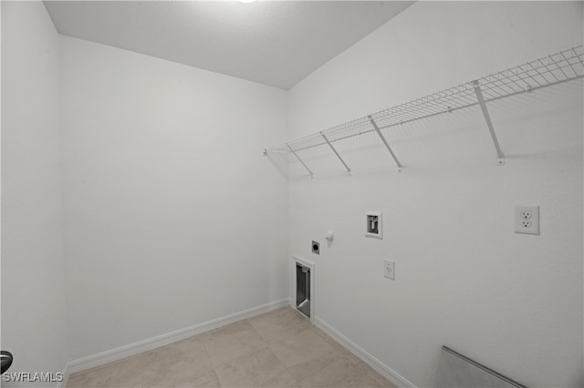 laundry area featuring gas dryer hookup, washer hookup, hookup for an electric dryer, laundry area, and baseboards