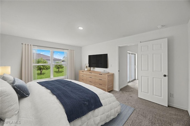 bedroom featuring carpet floors and baseboards