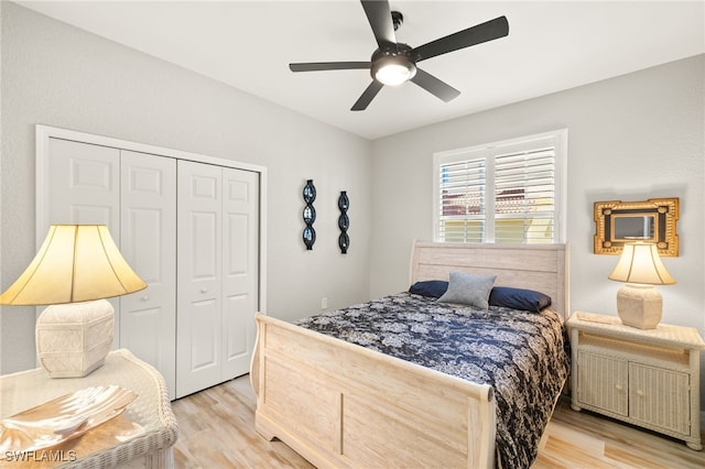 bedroom with a closet, a ceiling fan, and light wood-type flooring