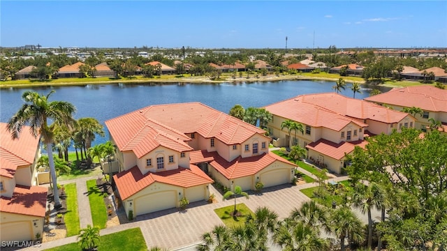 birds eye view of property with a residential view and a water view