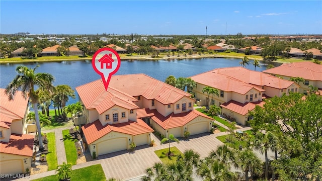 birds eye view of property with a residential view and a water view