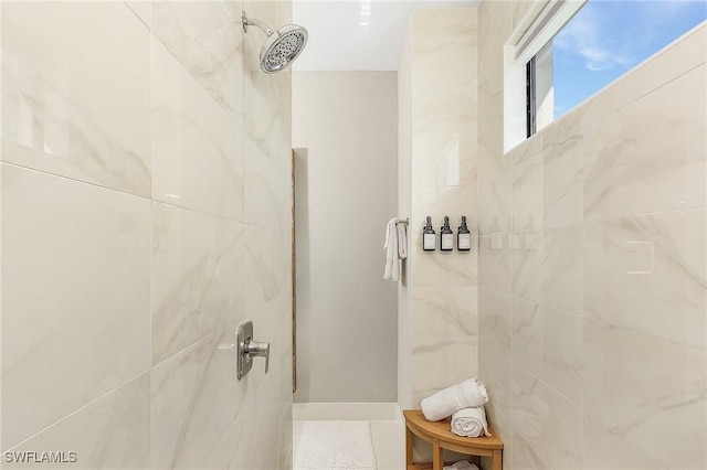 bathroom with tiled shower