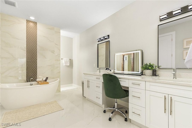 bathroom featuring a freestanding bath, vanity, visible vents, and marble finish floor