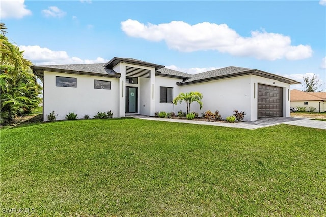 prairie-style house with concrete driveway, stucco siding, a front lawn, and a garage