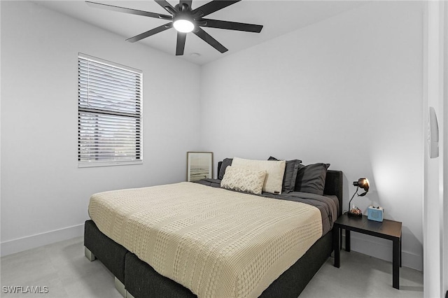 bedroom featuring baseboards and a ceiling fan