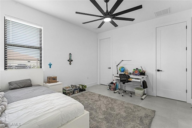 bedroom featuring a ceiling fan, visible vents, and finished concrete floors