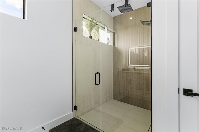 full bathroom featuring a shower stall