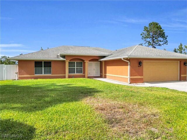 ranch-style home featuring a garage, stucco siding, and driveway