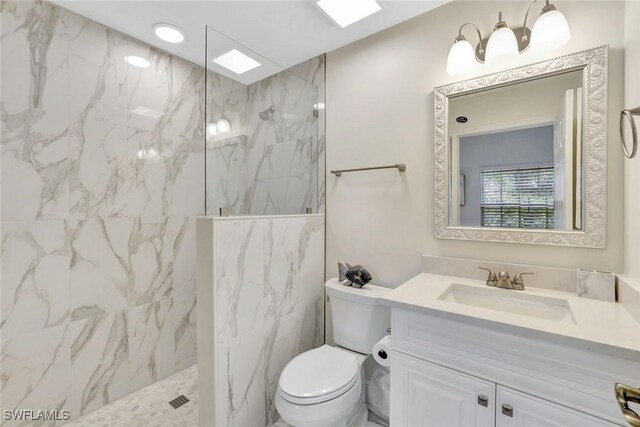 4500 Botanical Place Cir Unit 301, Naples, FL 34112 - full bathroom featuring vanity, a marble finish shower, and toilet
