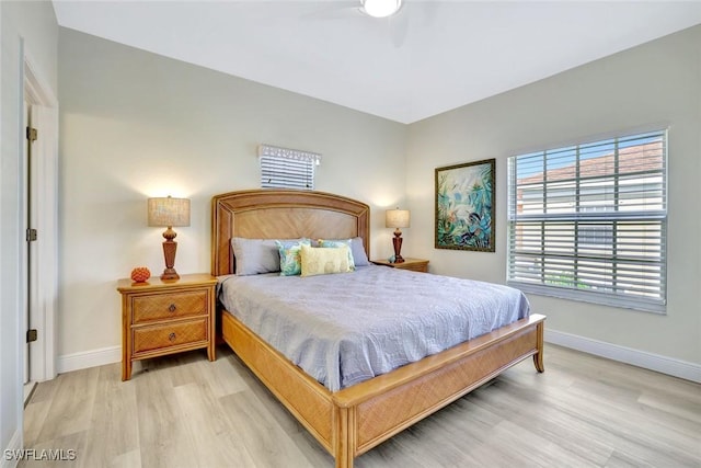 4500 Botanical Place Cir Unit 301, Naples, FL 34112 - bedroom with baseboards and wood finished floors