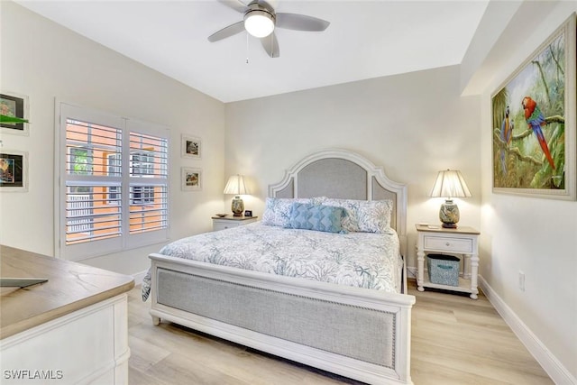4500 Botanical Place Cir Unit 301, Naples, FL 34112 - bedroom with light wood-style floors, baseboards, and ceiling fan