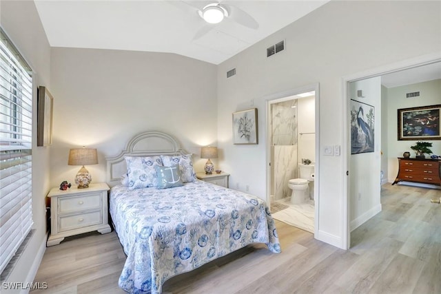 4500 Botanical Place Cir Unit 301, Naples, FL 34112 - bedroom with visible vents, light wood-style flooring, and vaulted ceiling