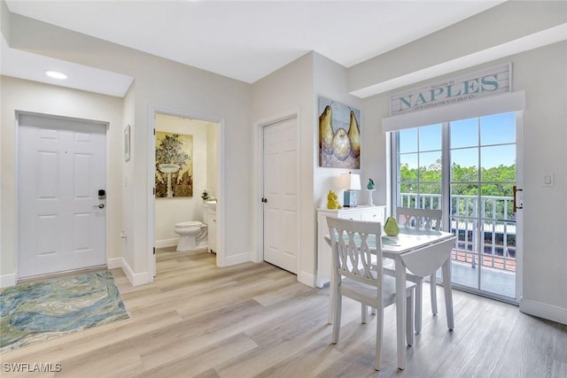 4500 Botanical Place Cir Unit 301, Naples, FL 34112 - dining space with baseboards, recessed lighting, and light wood-style floors