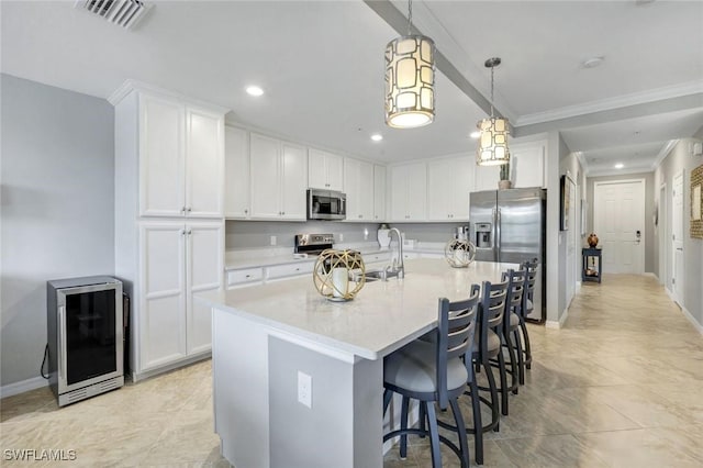 kitchen featuring visible vents, a sink, light countertops, stainless steel appliances, and recessed lighting