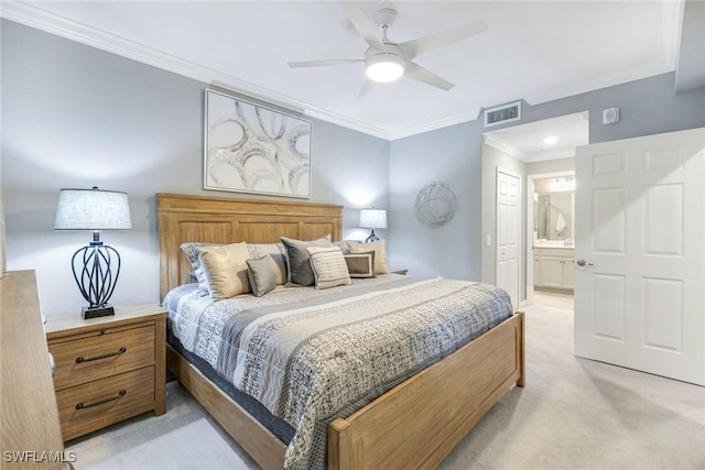 bedroom with light carpet, a ceiling fan, ensuite bathroom, visible vents, and ornamental molding