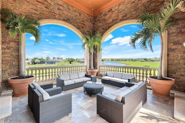 view of patio featuring an outdoor living space and a water view