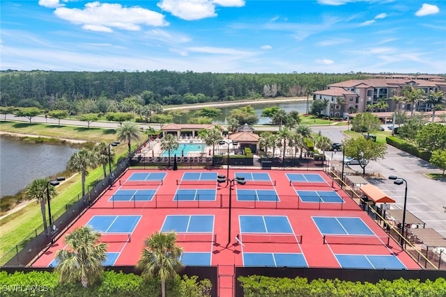 birds eye view of property with a water view