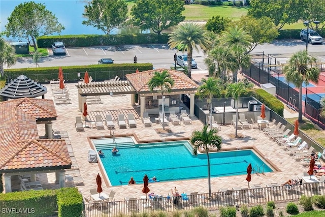 pool featuring fence, a patio, and a pergola
