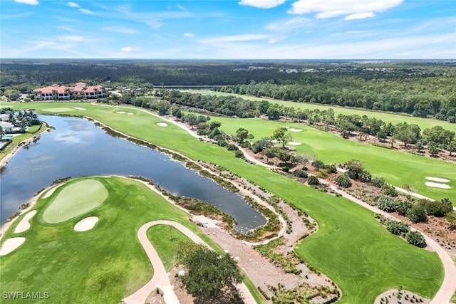 drone / aerial view with a water view and golf course view