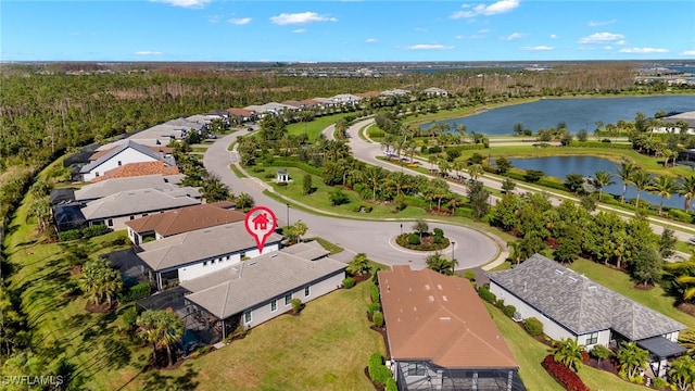 drone / aerial view with a water view and a residential view