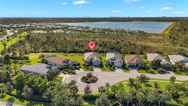 bird's eye view featuring a residential view and a water view