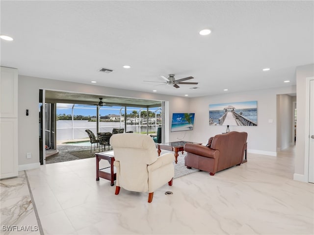 living area featuring marble look tile flooring, recessed lighting, baseboards, and a ceiling fan