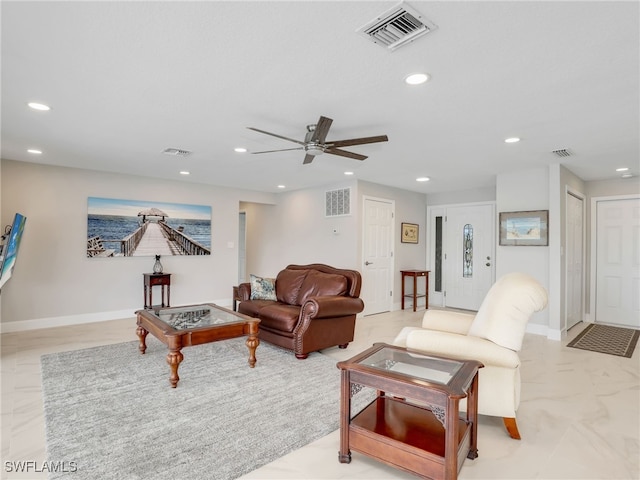 living room featuring recessed lighting, ceiling fan, and baseboards
