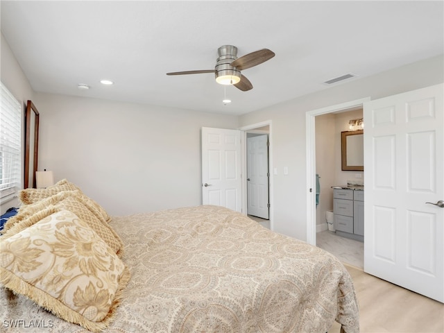 bedroom with ensuite bathroom, recessed lighting, and ceiling fan