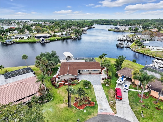 aerial view of residential area featuring a large body of water