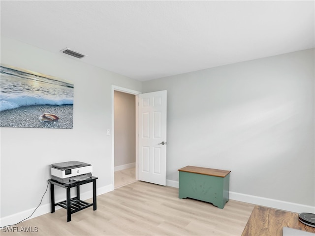 interior space with light wood-type flooring and baseboards