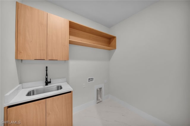 laundry room with washer hookup, cabinet space, a sink, baseboards, and marble finish floor