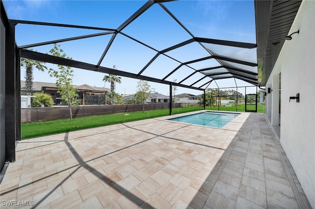 pool featuring a lawn, a patio area, and a lanai