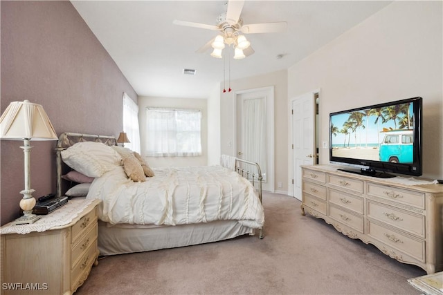 20849 Santorini Way N, Fort Myers, FL 33917 - bedroom with a ceiling fan, visible vents, and light carpet