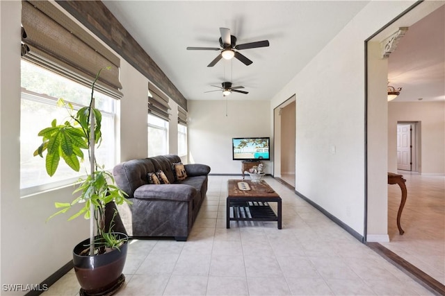 20849 Santorini Way N, Fort Myers, FL 33917 - living room with light tile patterned flooring, ceiling fan, and baseboards