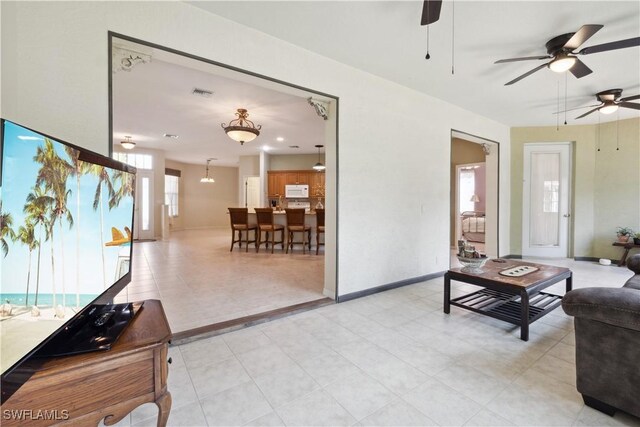 20849 Santorini Way N, Fort Myers, FL 33917 - living room with baseboards, a ceiling fan, and visible vents