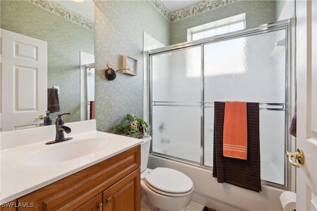 20849 Santorini Way N, Fort Myers, FL 33917 - full bath featuring vanity, enclosed tub / shower combo, toilet, and wallpapered walls