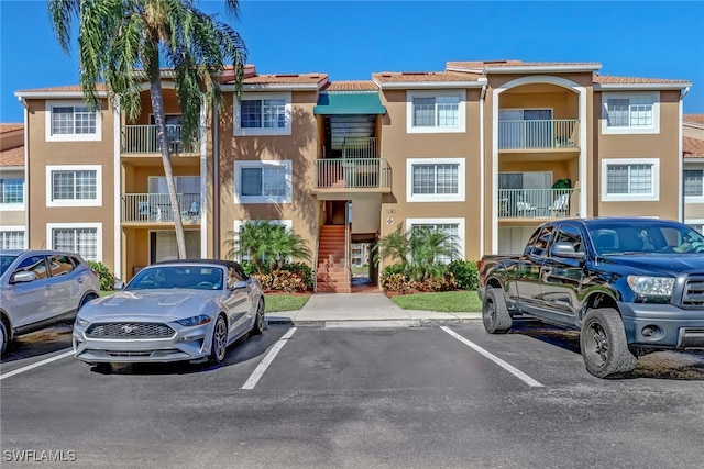 view of property with uncovered parking